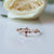 Delicate Ruby studded Floral Cross Ring in Solid 14k Rose Gold